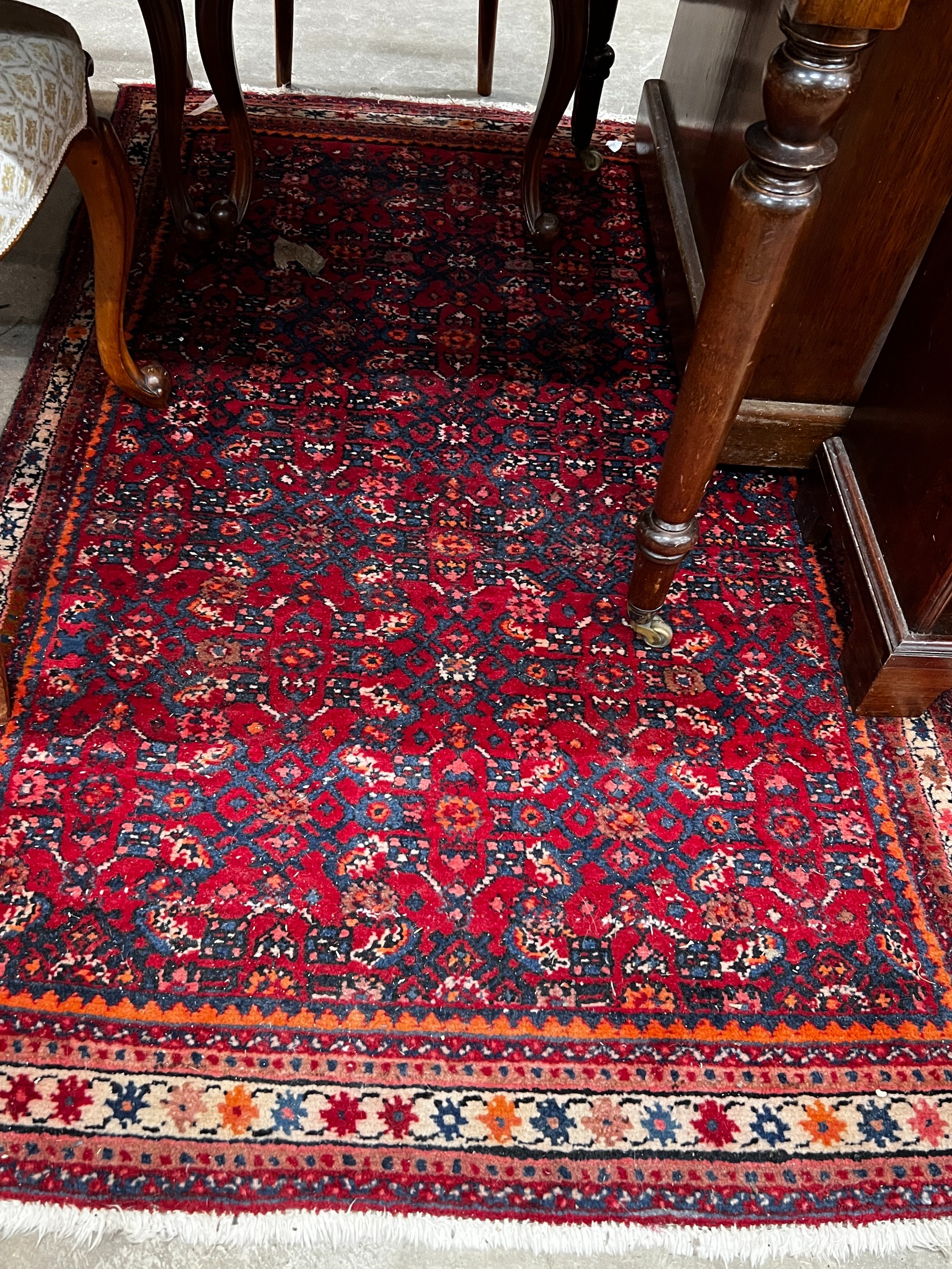 A North West Persian red ground rug, 164 x 105cm